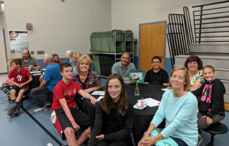 students at breakfast with grandparents